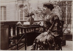 Marcelle Tinayre Sitting, a Book on a Table in Front of Her by Dornac